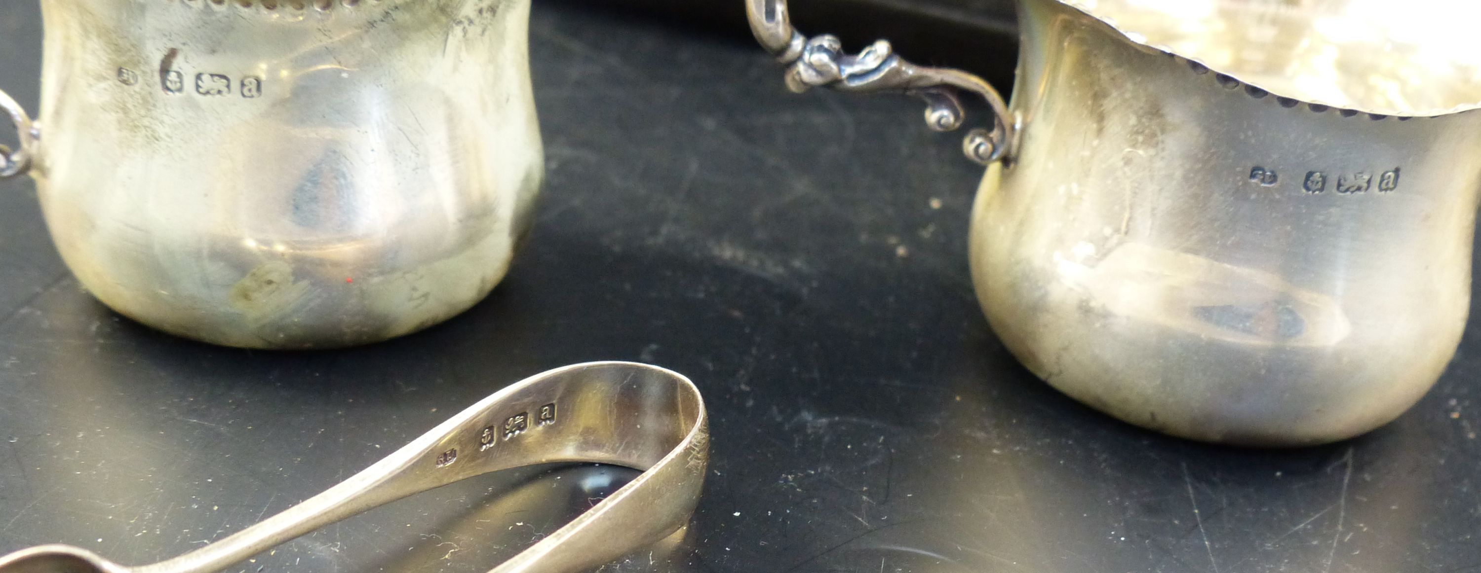 A late Victorian cased silver three piece cream and sugar set, 84 grams.
